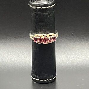 Sterling Silver Ring with Red Gemstone and Gold Accent